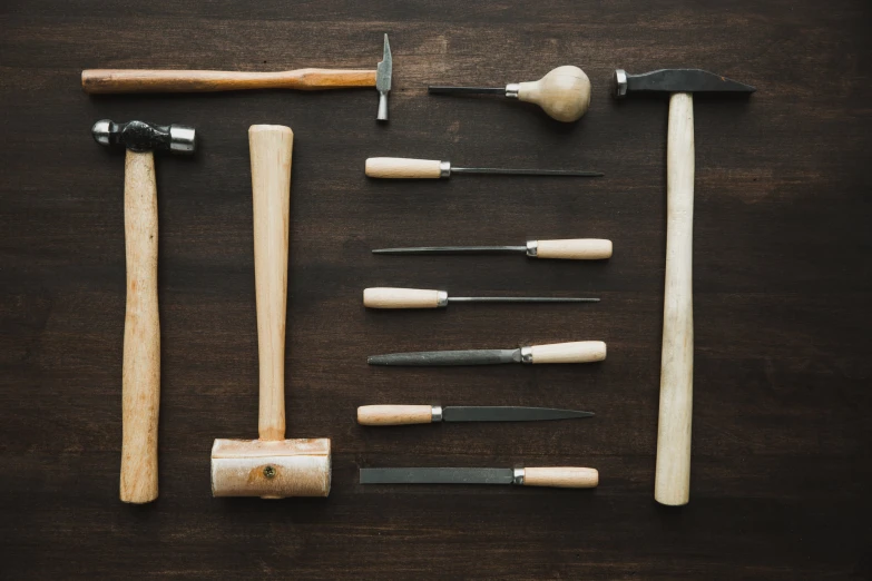 the tools are laying on a wooden table