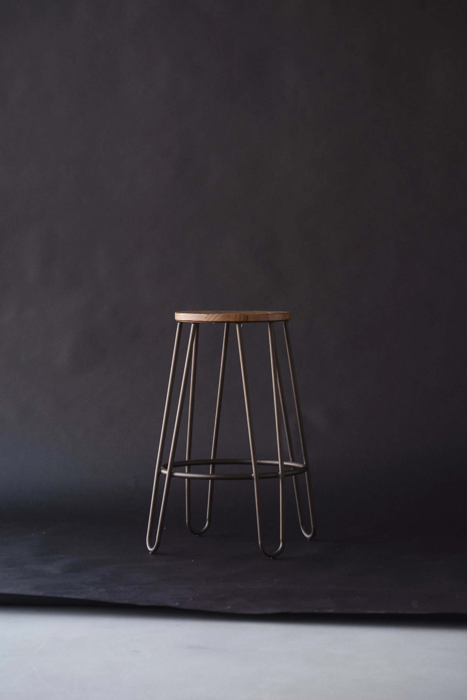 an image of a small stool that is in the spotlight