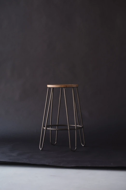 an image of a small stool that is in the spotlight