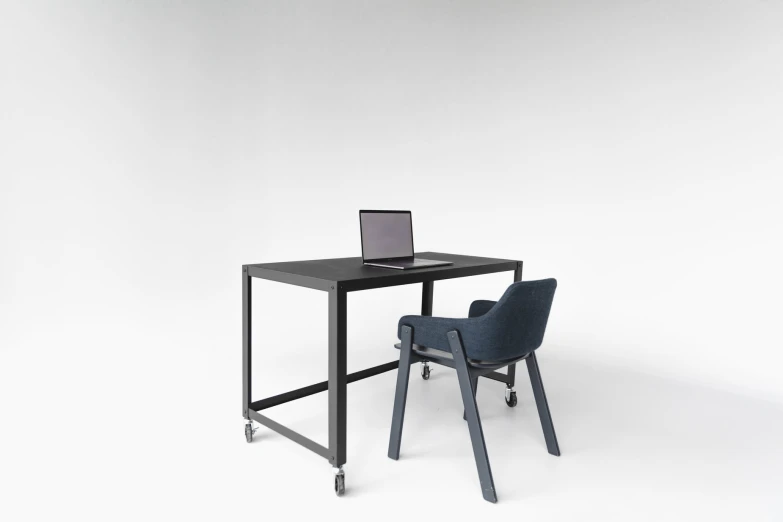an office desk with a computer on it