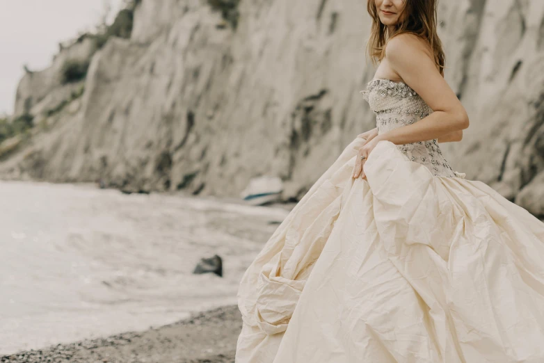 a woman is dressed up in a white dress