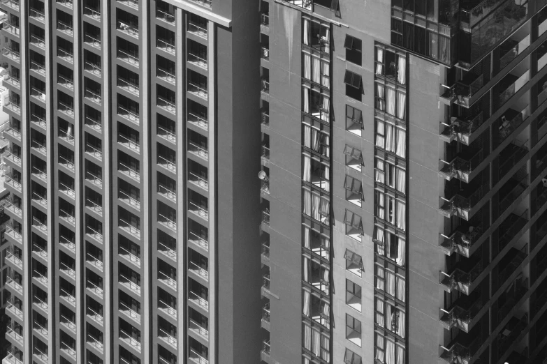 looking up at many apartment buildings, and the view is clear