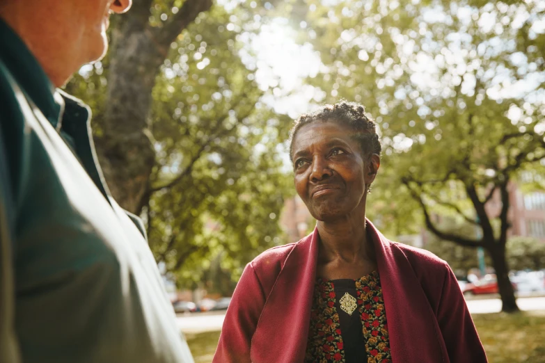 a man and an older woman looking at each other