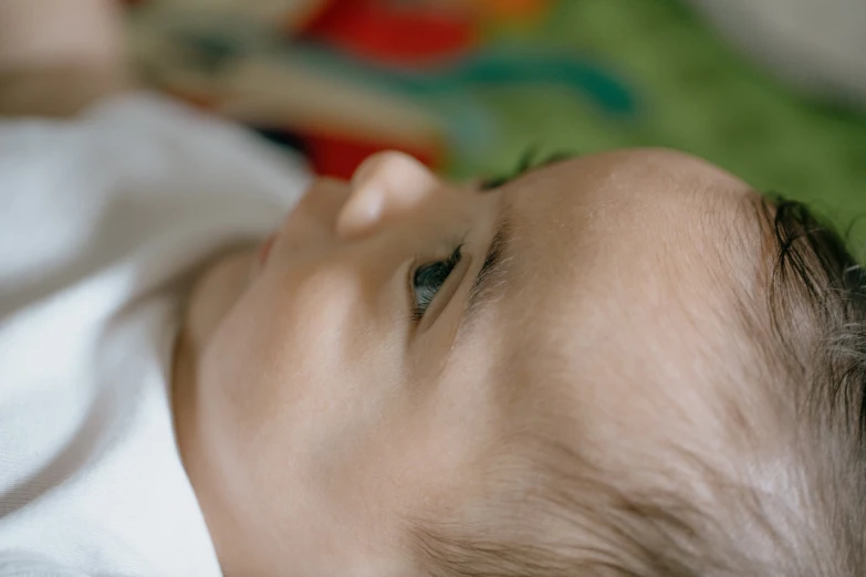 a close up of a baby laying down