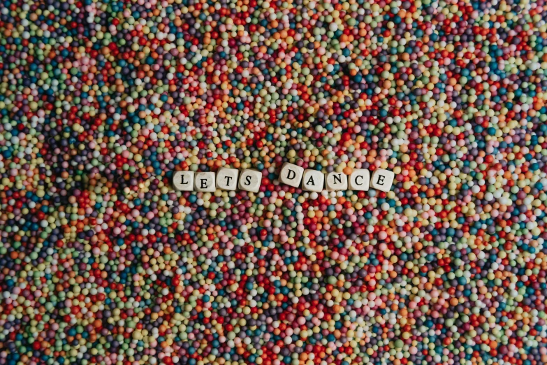 words are placed on the top of several balls of beads