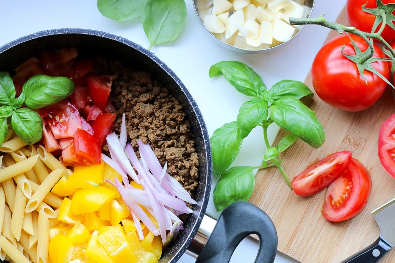 a pan with food in it sitting on top of a  board