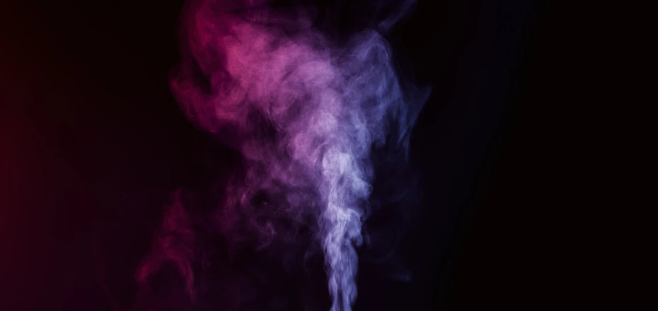 a cloud of smoke on a black background
