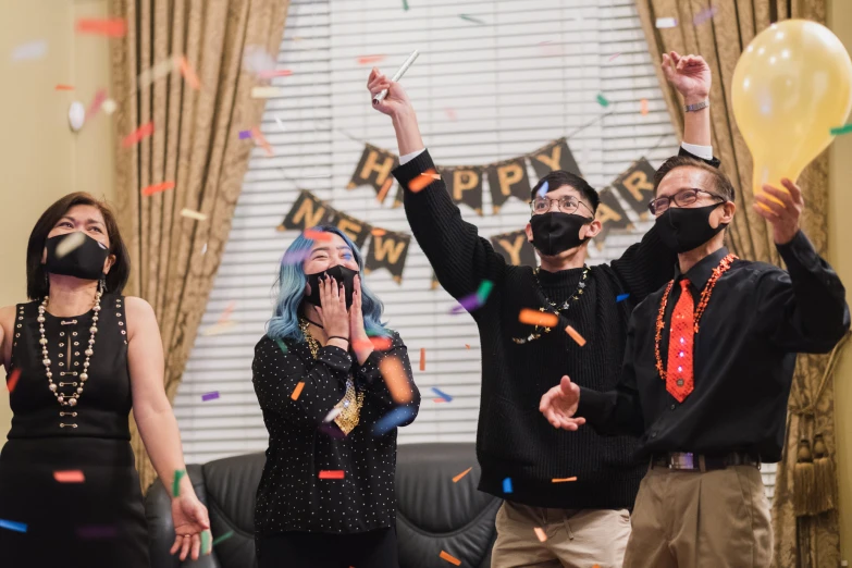 a group of people that are wearing face masks