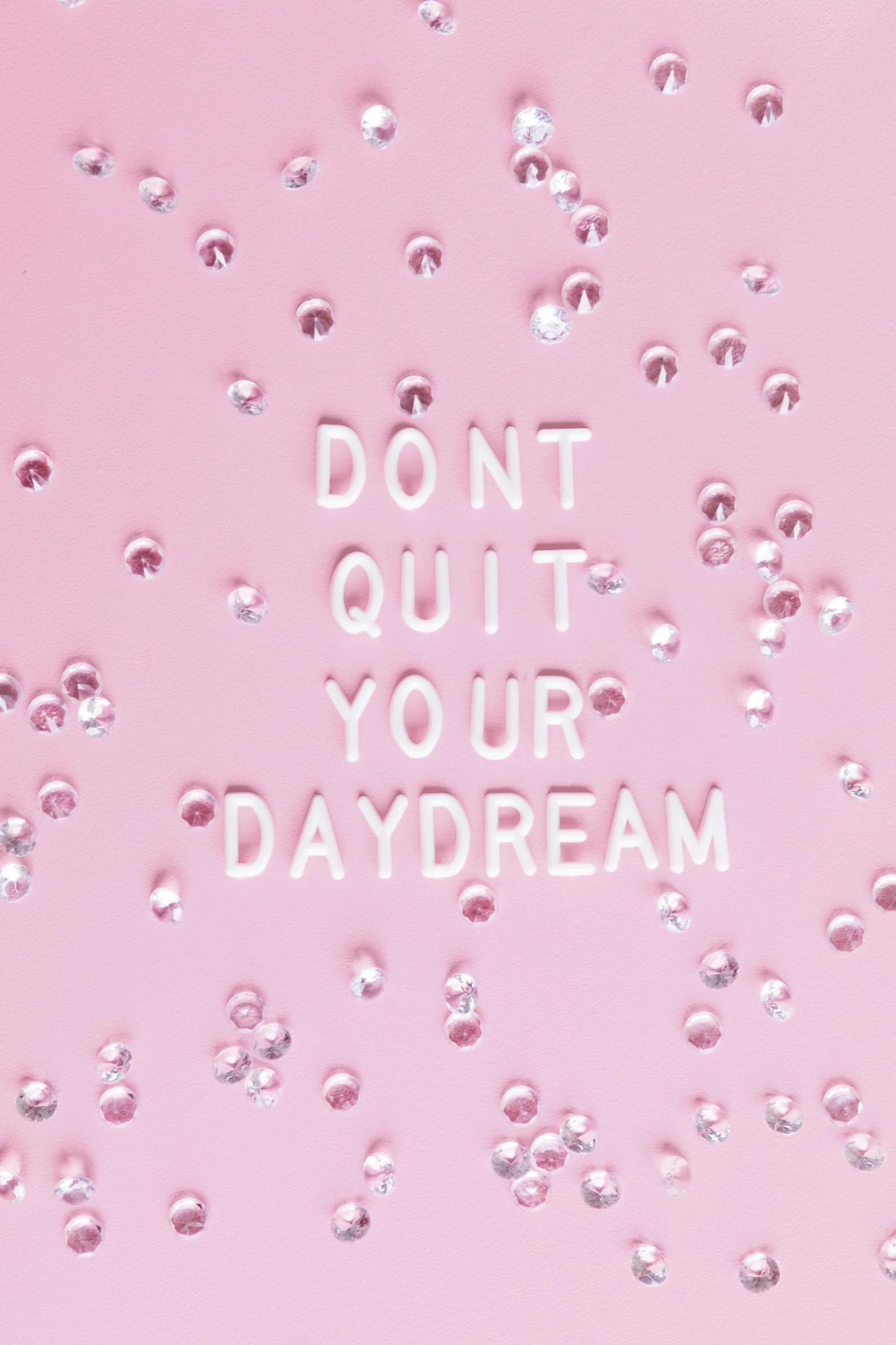 the words don't quit your daydream are depicted in bubbles