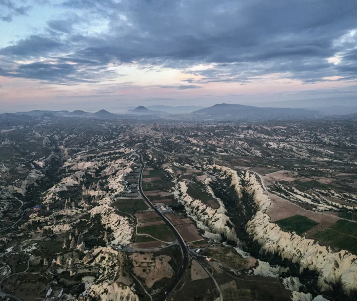 an airplane that is flying above the countryside