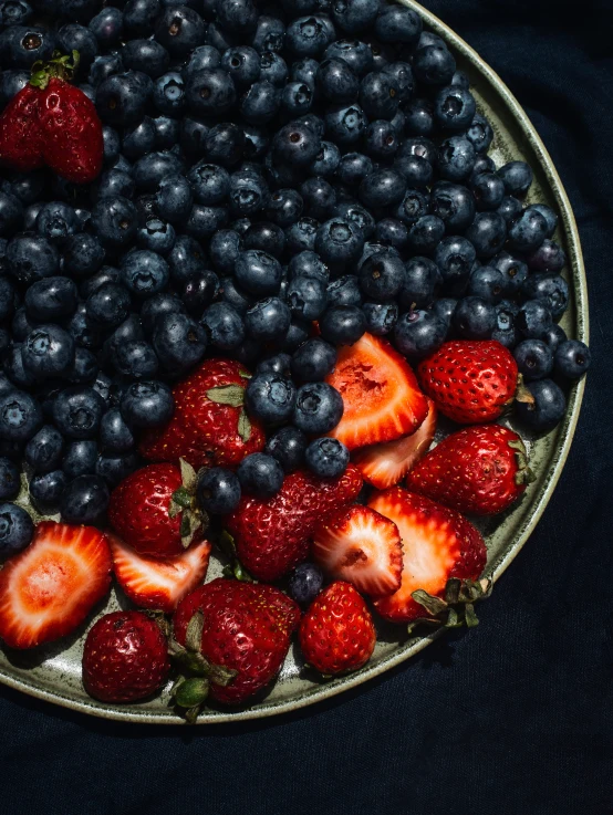 blueberries and strawberries arranged on top of each other