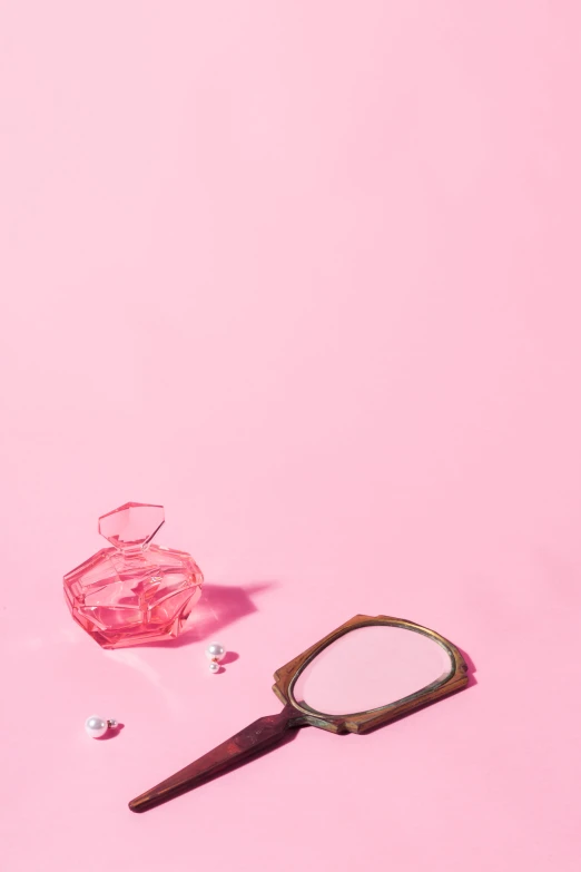 a pink object laying on a pink surface