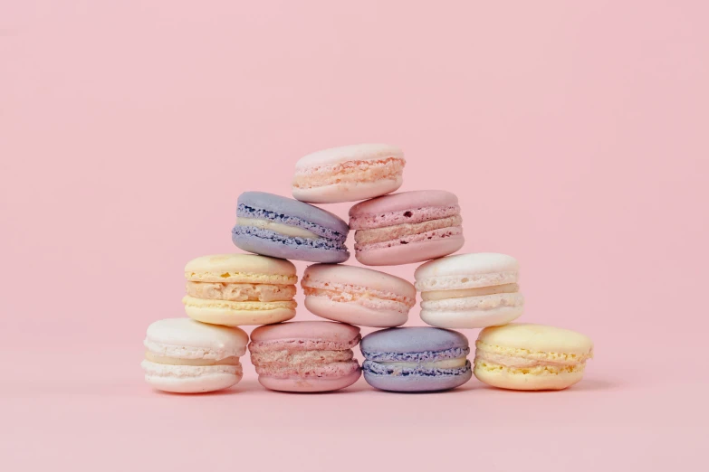 some colorful macaroons that are stacked on each other