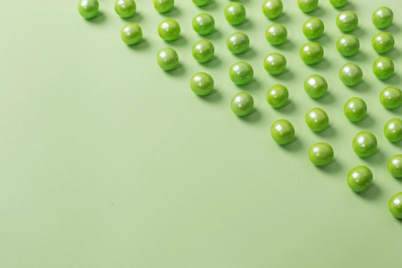several small candies are on a light green table