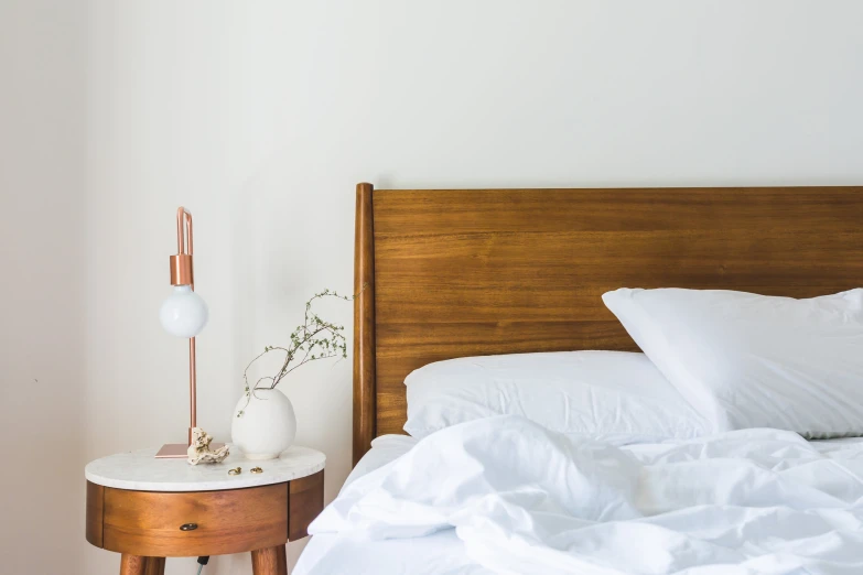 the bedroom is decorated in neutral and fresh colors