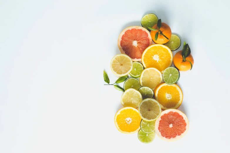 an assortment of fruit sliced and arranged in a variety of shapes and sizes