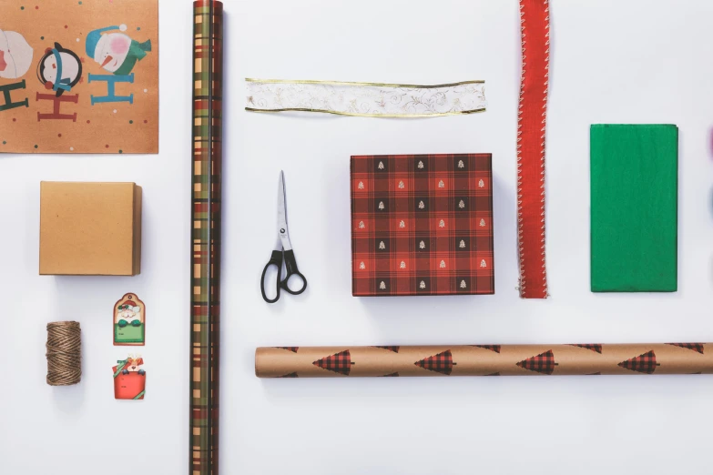 the supplies for making a christmas card sitting on a table