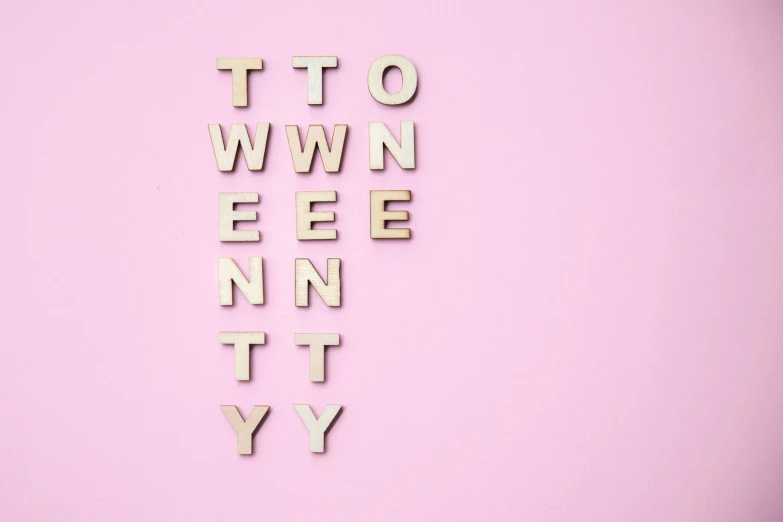 an upper and lower case spelling spelled by a number on a pink background