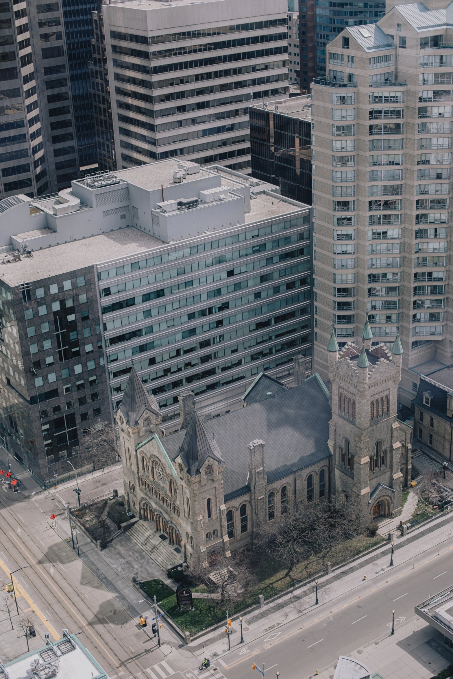 an aerial view of a city with a train and building