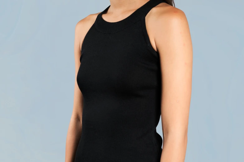 a woman in black tank top standing