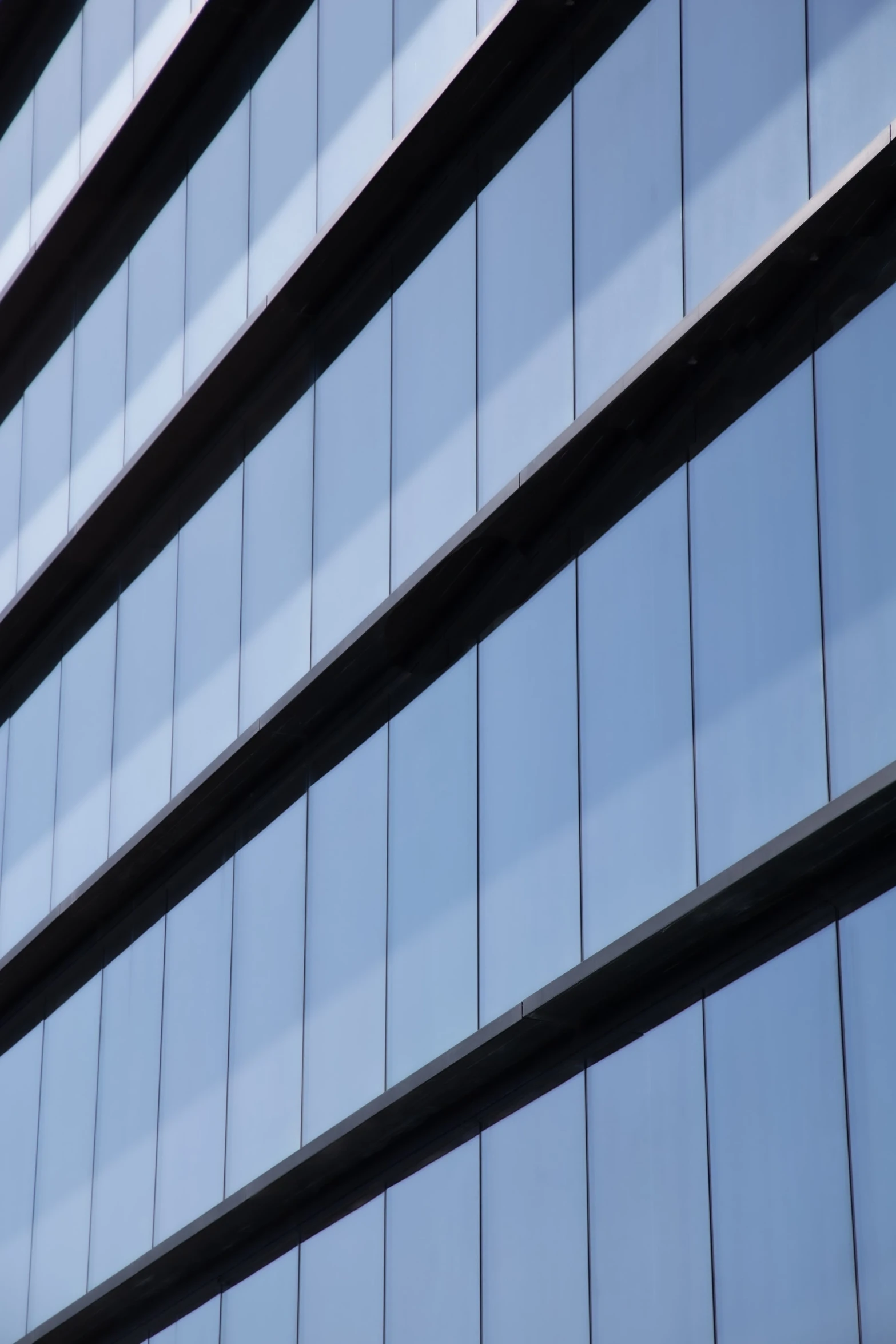 a close up of a high rise glass building