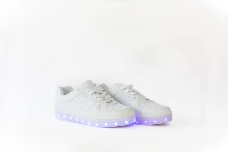 a white sneaker with lights on the side