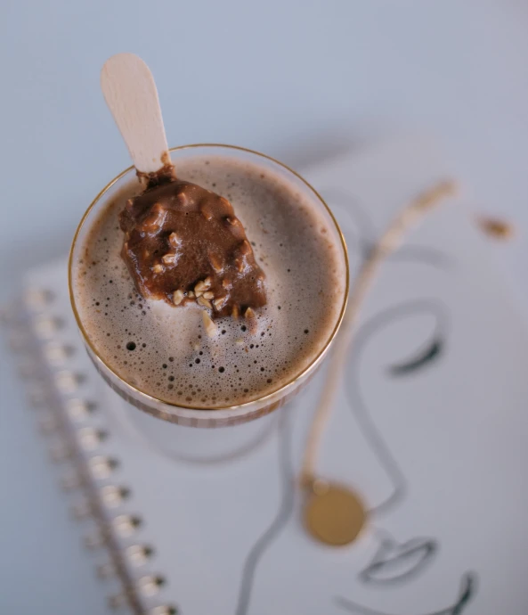 a drink of chocolate and ice cream on a small plate