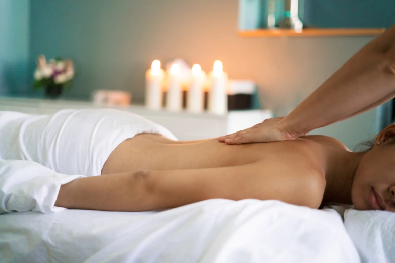 a woman receiving a massage at the health center