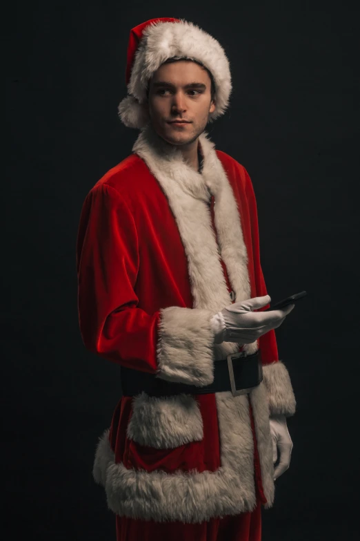 man wearing a santa claus suit, holding a platter of food