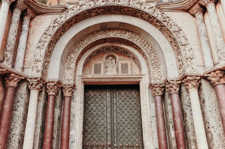 a cathedral with arches, doors and large pillars