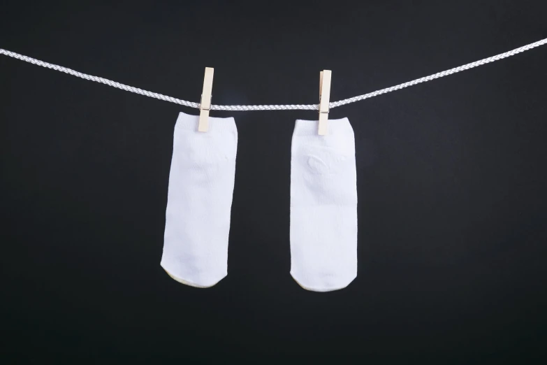 a pair of socks hanging from a rope