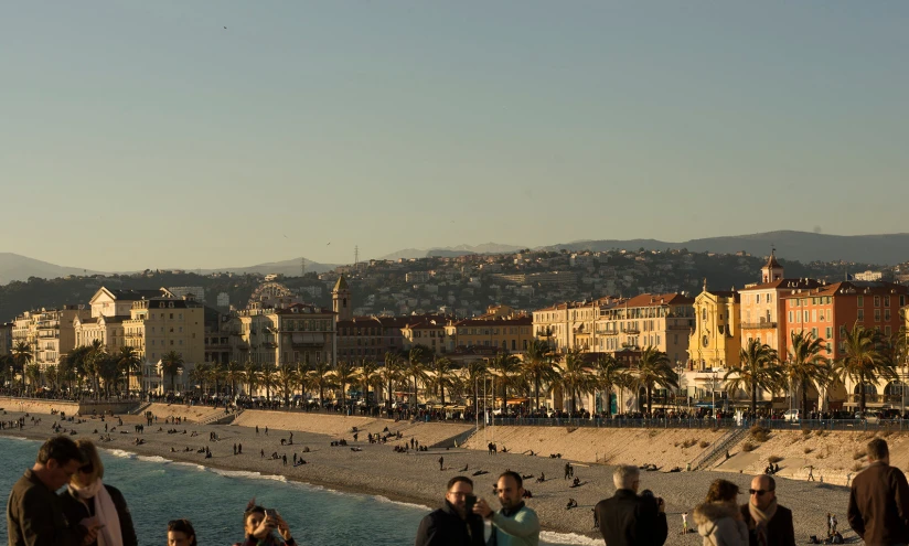 a beach is crowded with people near the ocean