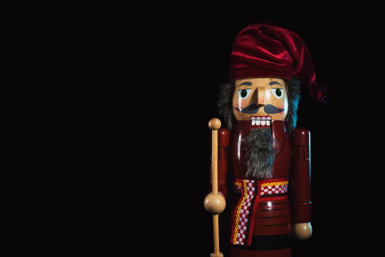 a nuter figure with a big beard and red turban