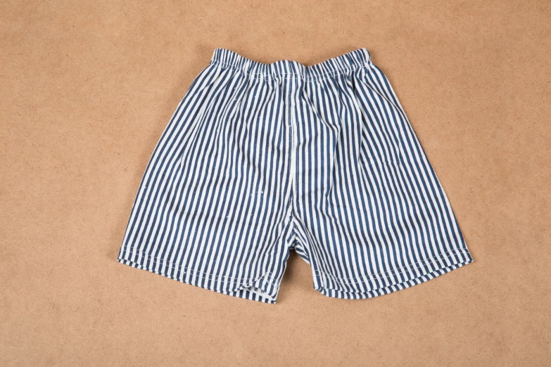 a white and blue striped shorts on a tan background