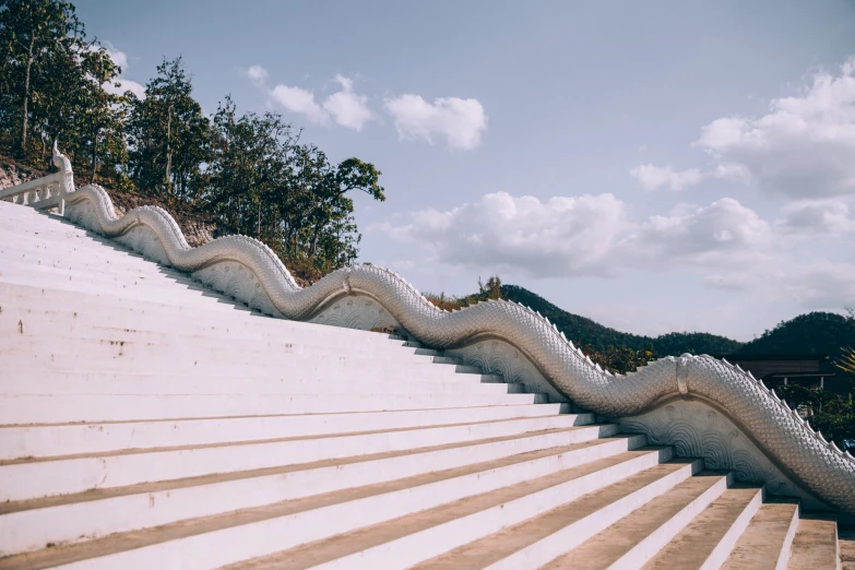 the white steps are lined with intricate designs