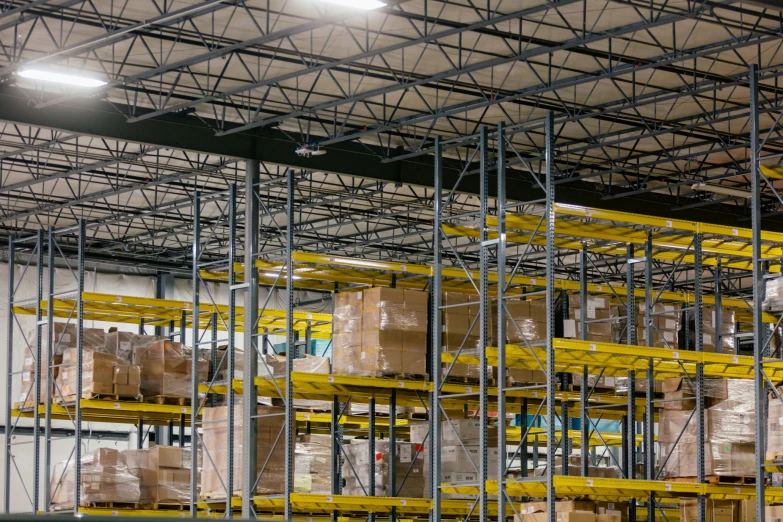 shelves of boxes in a warehouse with a lot of shelves