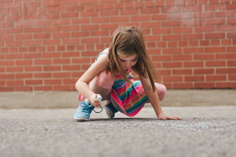  crouched down while writing on the ground