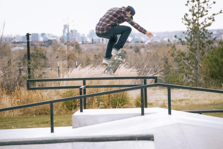 a man on a skateboard grinding down the rail