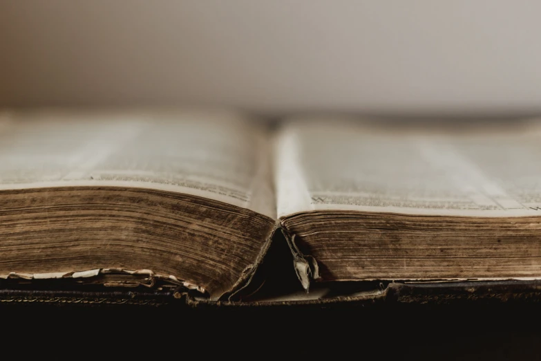 the open book is laying open on a table