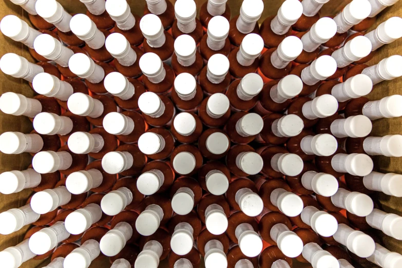 an overhead view of several brown and white bottles