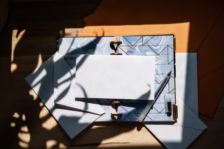 a table with many papers stacked on it