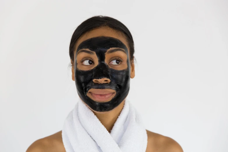 a woman has a facial mask on her face