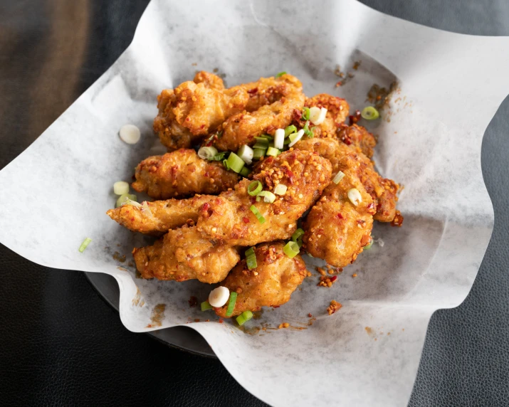 a dish of chicken with mustard and green onion