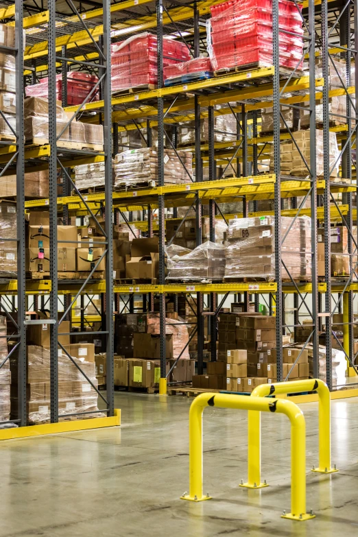 a large warehouse with metal racks filled with different types of goods