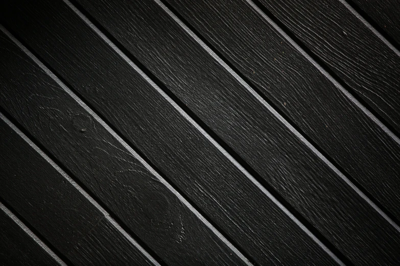 a dark po of lines on a wooden surface