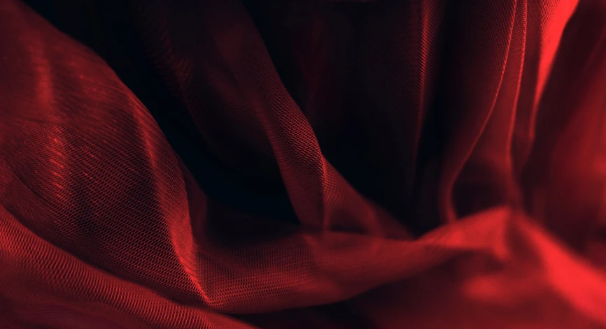 the texture of a red cloth cloth with very soft folds