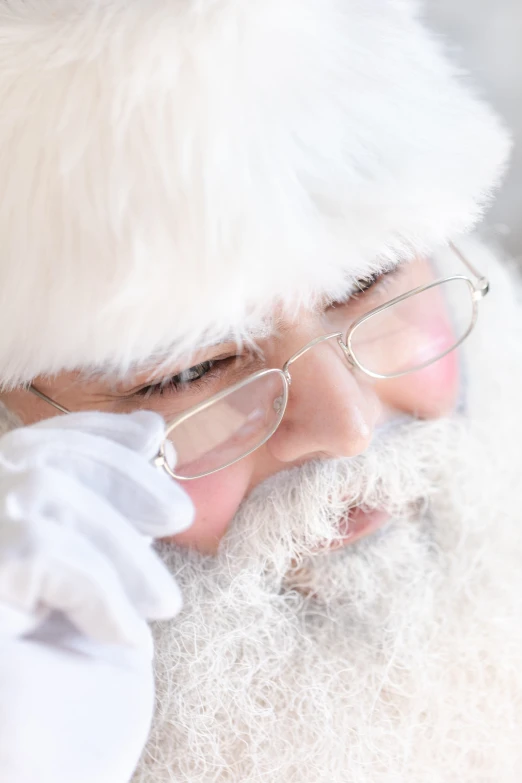 a close up po of a man in a santa costume