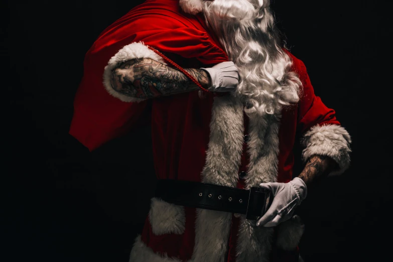 an image of santa clause holding onto his arm