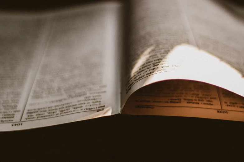 an open book sitting on top of a table