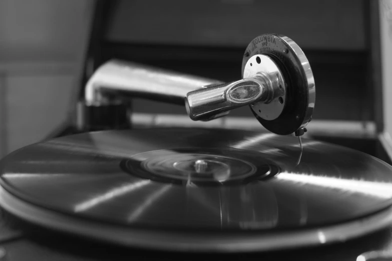 a record player spinning up on top of a turntable